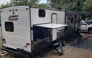 Exterior view of a RV rental with 2 canopys out