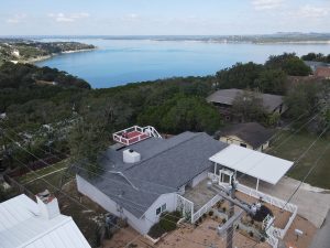 Aerial view of a rental house with roof deck looking out towards Canyon Lake